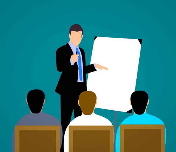 a man with a flip chart