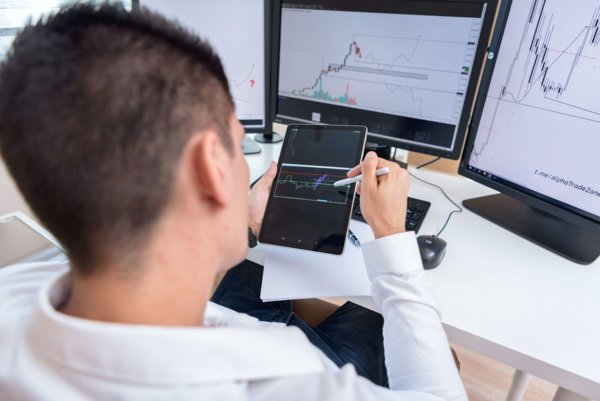 Man Monitoring Business Analytics