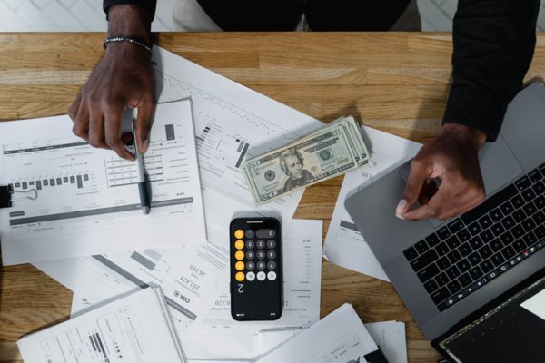 Man Calculating Employee Payments