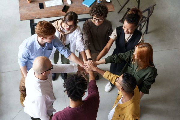 A Group Of People Acknowledging Teamwork