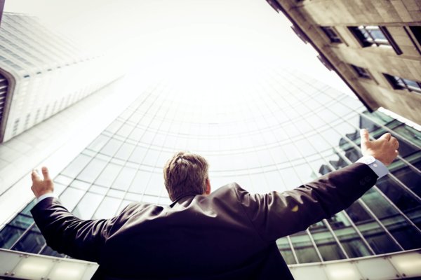 man with hands in the air