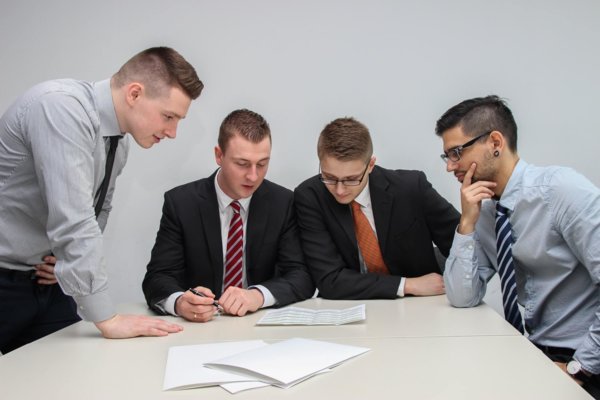 gathered around a laptop