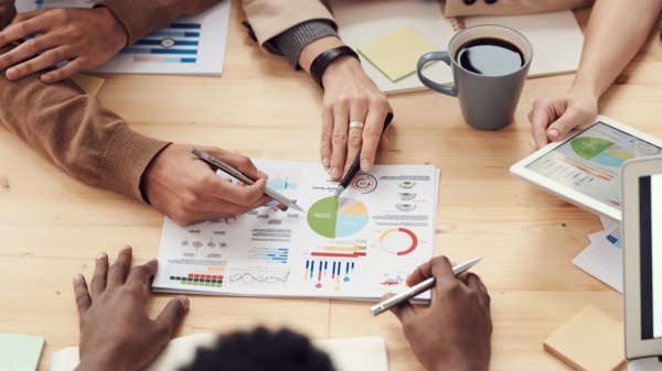 A Group of People Planning and Working