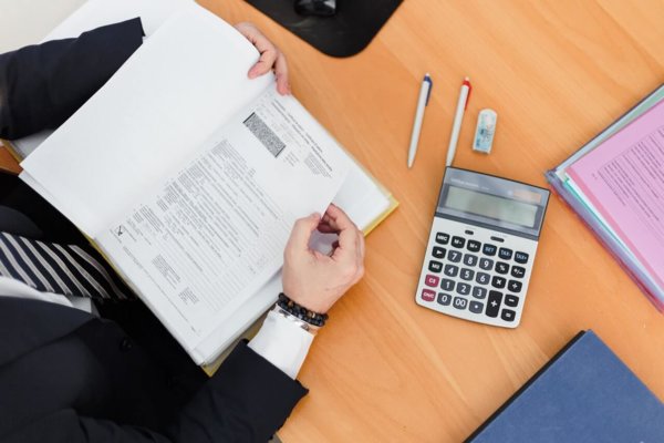 calculator and sheets of paper