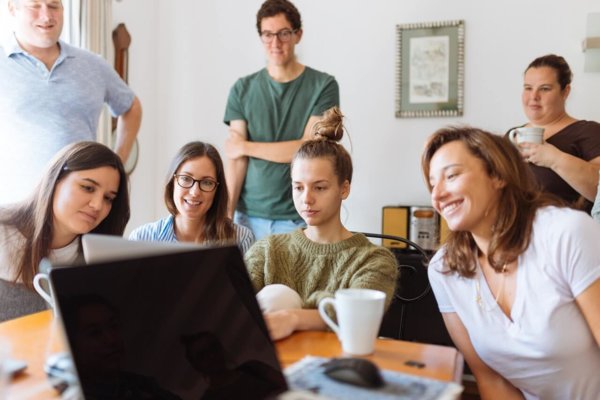 people around laptop