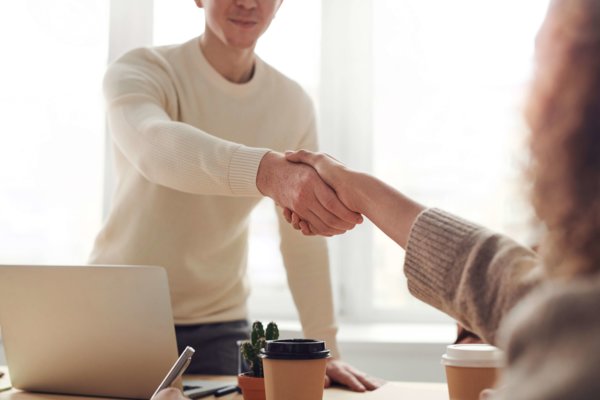 Two People shaking Hands After Interview