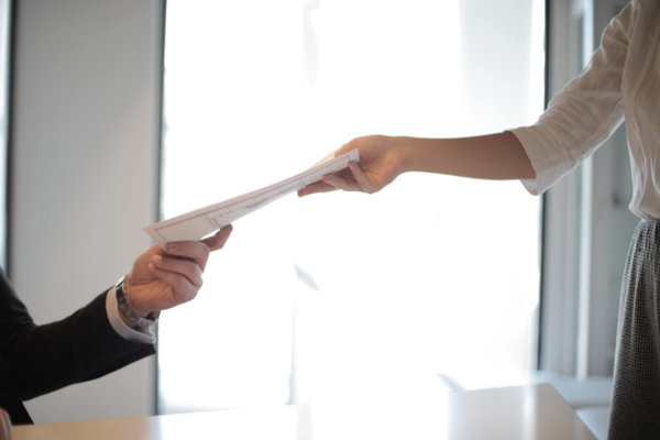 handing over paper