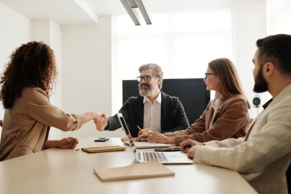 shaking hands in a meeting